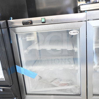 Brand new KoolMore KM-MDF46GD countertop display freezer, 24 in., 4.6 cu. ft., 115 volts, 1 phase, with visible scratch and dent.
