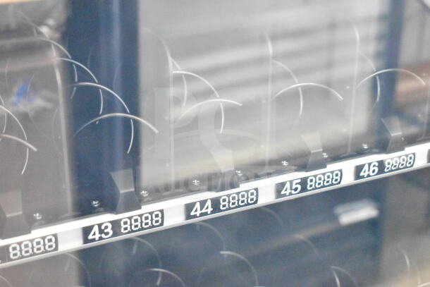 KoolMore commercial vending machine, brand new, scratch and dent condition, item slots numbered 43 to 46 visible.