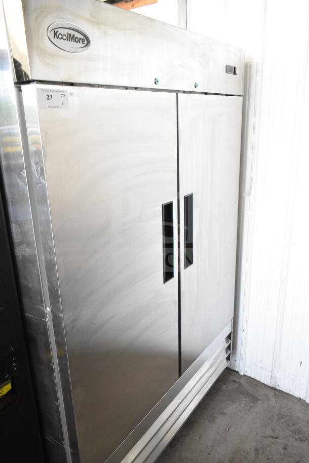 Brand new KoolMore RIR-2D-SS 54" two-door reach-in refrigerator, 47 Cu Ft, on commercial casters, slight scratches.