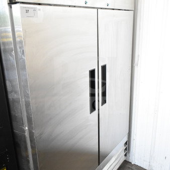 Brand new KoolMore RIR-2D-SS 54" two-door reach-in refrigerator, 47 Cu Ft, on commercial casters, slight scratches.