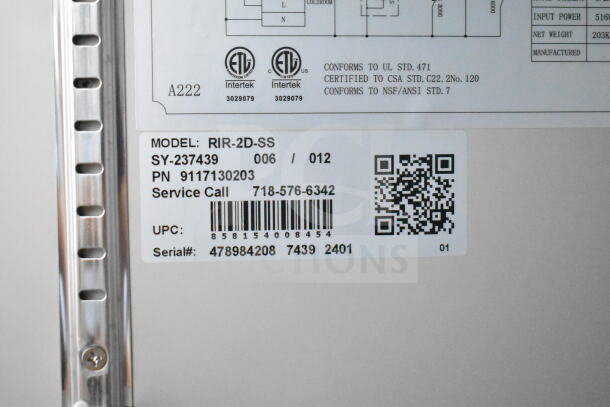 Label on KoolMore RIR-2D-SS 54 in. fridge showing model, serial number, and service call details.