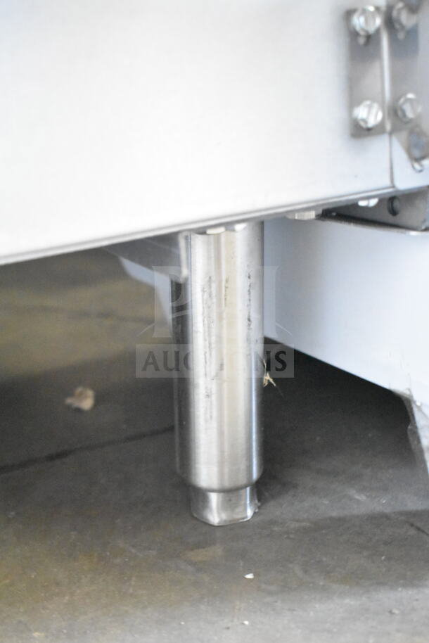 KoolMore commercial hot plate range with stainless steel leg, showing minor scratches.