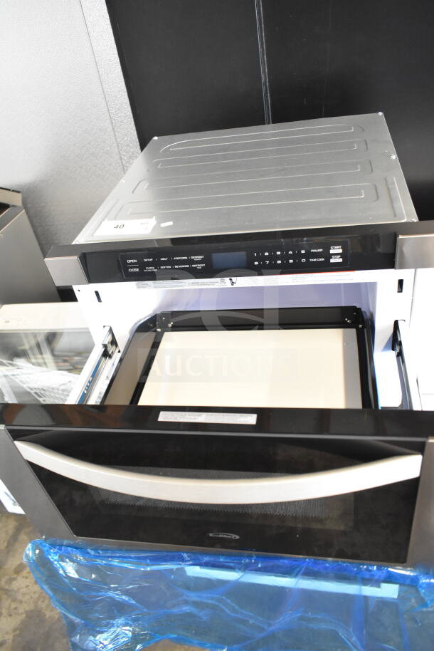 Brand new KoolMore countertop drawer microwave oven, 115 volts, 1 phase. Slight scratch and dent visible.