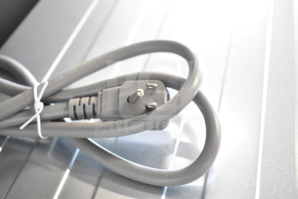 KoolMore Countertop Drawer Microwave Oven power cord shown on metallic surface. Brand new, 115 volts, 1 phase.