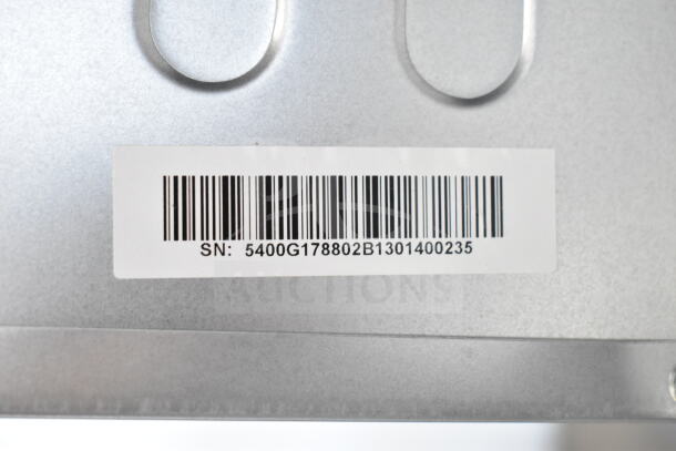 Barcoded serial number label on the back of a brand new KoolMore countertop drawer microwave, indicating SN: 5400G178802B1301400235.