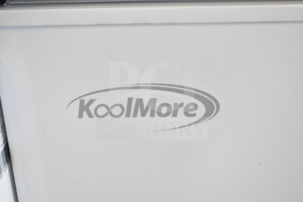 Brand new KoolMore SCF-7C 37" commercial chest freezer, 7 cu ft, 115 volts, with minor scratches and dents visible.