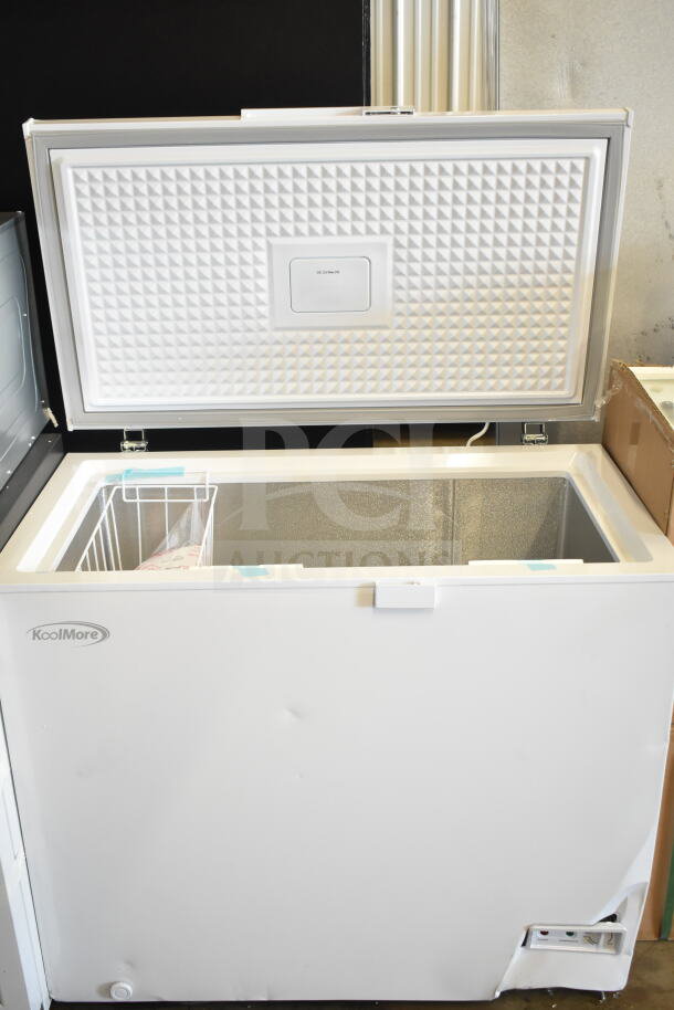Brand new KoolMore SCF-7C 37 in. commercial chest freezer, 7 cu ft, with minor dents, 115 volts, 1 phase, includes wire basket.