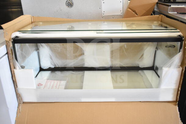 Brand new KoolMore dry display case merchandiser in original packaging. Scratch and dent condition. Visible KoolMore logo.