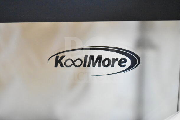 Brand new KoolMore dry display case merchandiser with minor scratches and dents; features durable construction and ample display space.