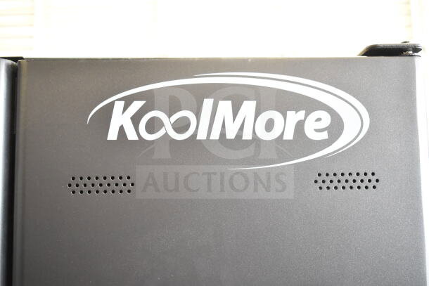 KoolMore commercial vending machine, brand new, scratch and dent condition, featuring KoolMore logo, durable metal frame.