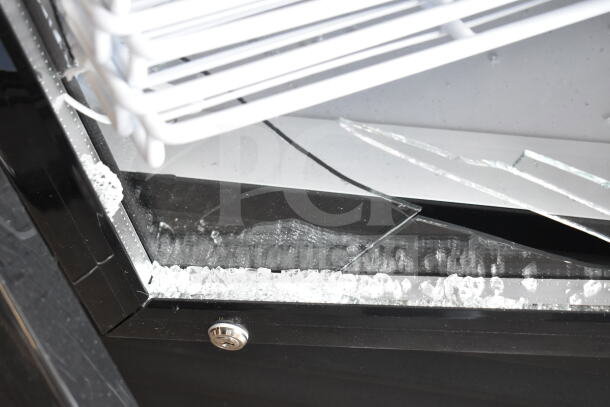 KoolMore 3 Door Cooler with broken glass and dented doors, scratch and dent condition.