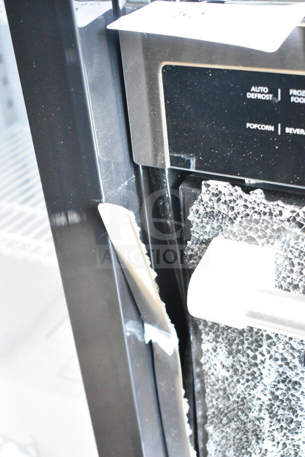 KoolMore KM-CWO24-AFSS microwave oven with visible broken glass, auto defrost, and convection features. Scratch and dent condition.