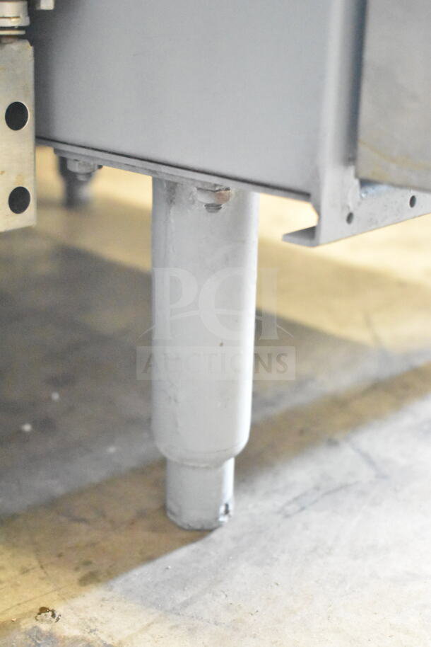 Pitco Frialator commercial gas deep fat fryer, floor style, sturdy metal construction, shown from the base.