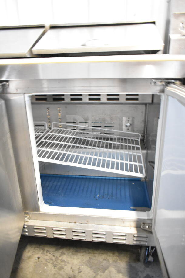 Ascend JSP-7218 commercial sandwich salad prep table on casters, features spacious interior, 115 volts, 1 phase, mega top.