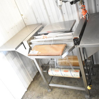 Commercial floor-style wrapping station with Hobart scale, label printer, 115 volts, 1 phase. Appears in used condition.