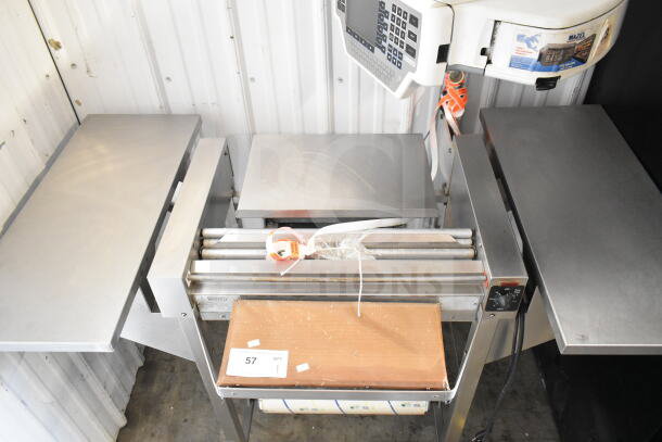 Commercial wrapping station with Hobart scale and label printer, stainless steel, 115 volts, 1 phase, in good condition.