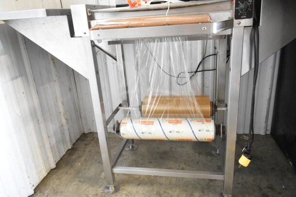 Commercial wrapping station with Hobart scale, BioWrap film, label printer, 115V, 1 phase, stainless steel frame.