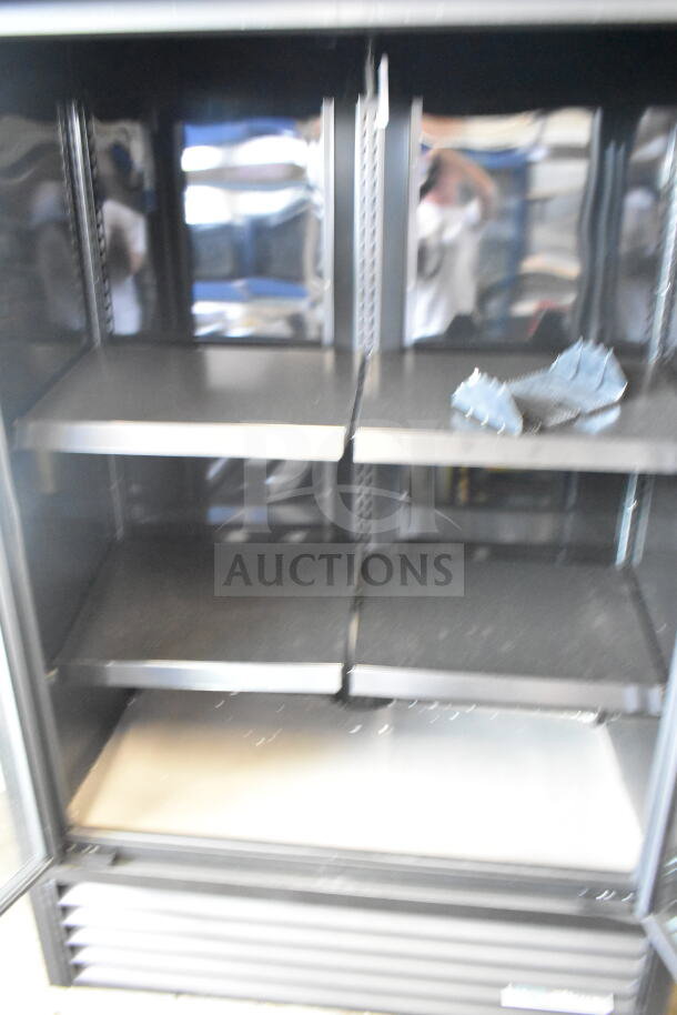 2025 True TVM-48SL-HC 2 Door Reach-In Cooler Merchandiser, 115V, 1 Phase, shelves visible, excellent condition.
