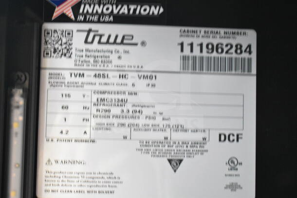 True TVM-48SL-HC cooler label showing specs: 2 door reach-in, 115 volts, 1 phase, serial number 11196284.