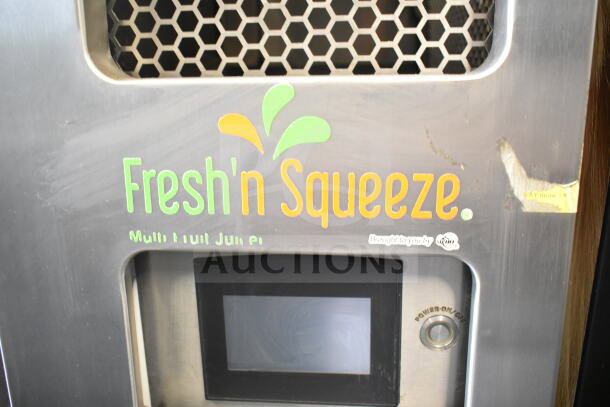 Commercial JBT 2ND-GEN-MFJ-HE Fresh N Squeeze citrus juicer, stainless steel, digital display, 115V, floor model, on casters.