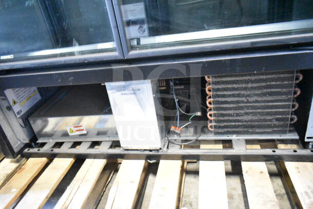 2022 True TVM-48SL-HC 2 Door Cooler, commercial model, 115V, 1 Phase, open base view, visible coils, tags attached.