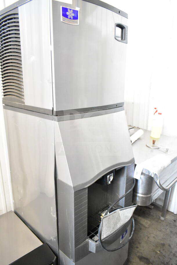 Manitowoc commercial ice head on hotel ice dispenser, stainless steel, used condition, large capacity, visible logo label.