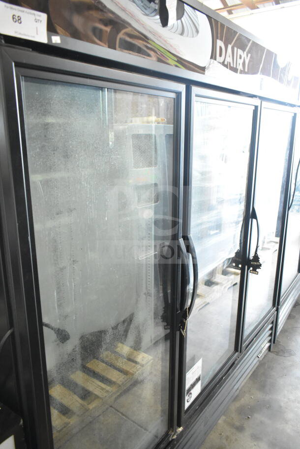 2019 True GDM-72-HC 3-door reach-in cooler merchandiser, 115 volts, 1 phase. Visible wear on glass doors.
