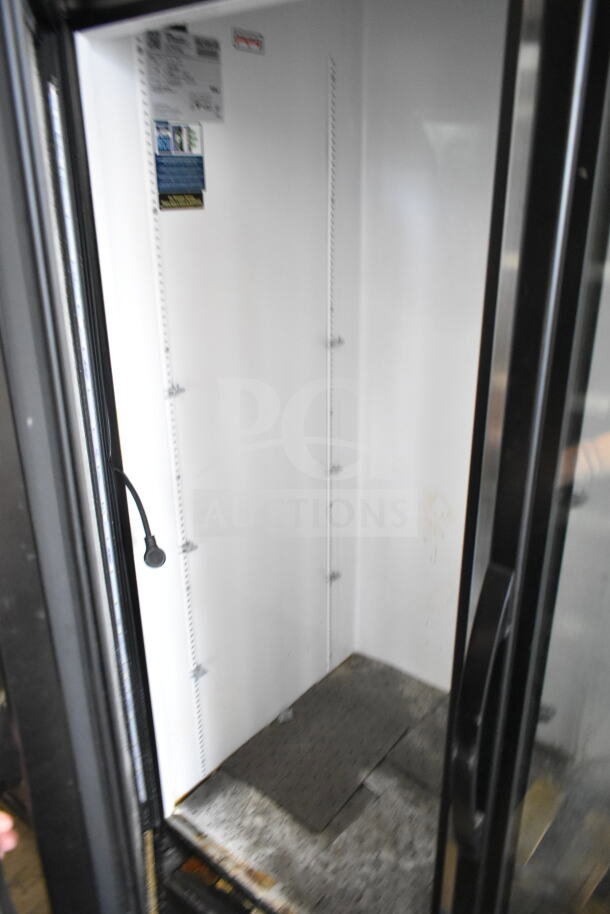 2019 True GDM-72-HC 3 Door Reach-In Cooler Merchandiser. Visible interior with shelf supports. 115 Volts, 1 Phase.