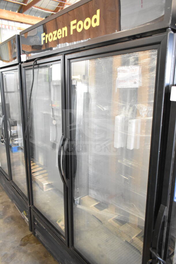 2018 True GDM-49F-HC commercial 2-door reach-in freezer merchandiser with glass doors. Model details visible.