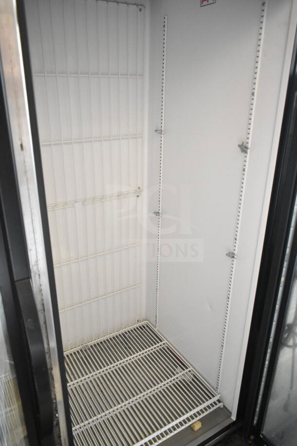 2018 True GDM-49F-HC commercial freezer, two-door, empty interior view, white wire shelves, excellent condition.
