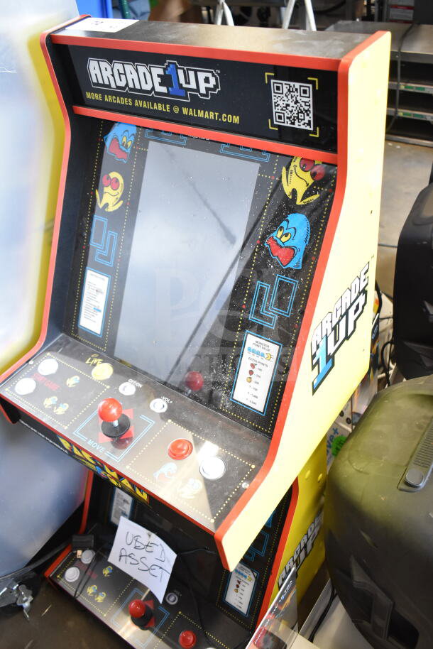 Arcade1up PAC-A-501030 Pac Man arcade game, used condition, with colorful retro graphics and controls.
