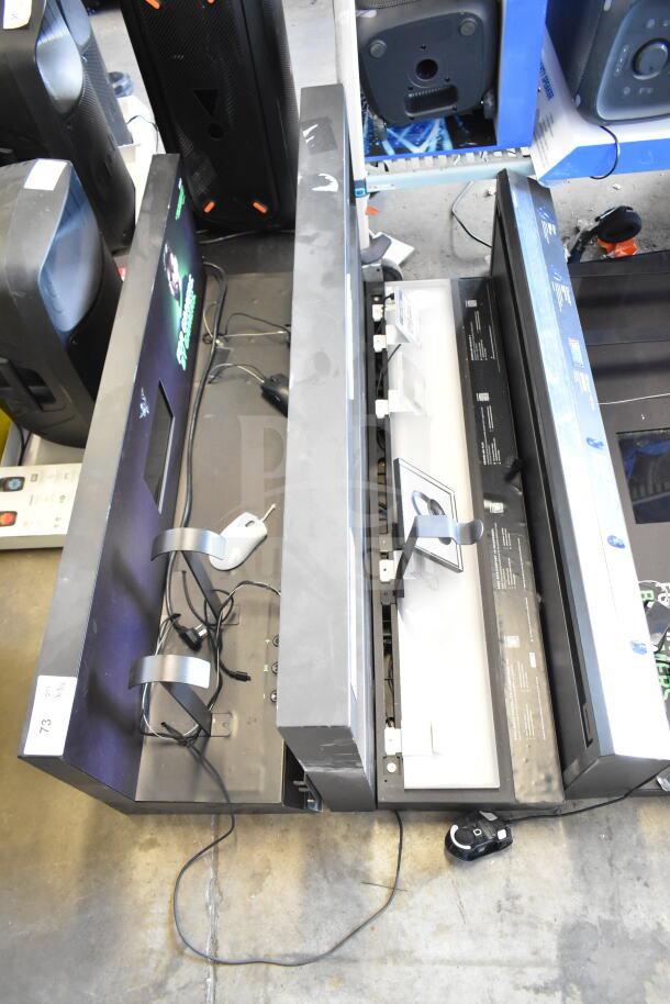Three store displays featuring computer mice, in used condition with cables. Signs of wear visible.