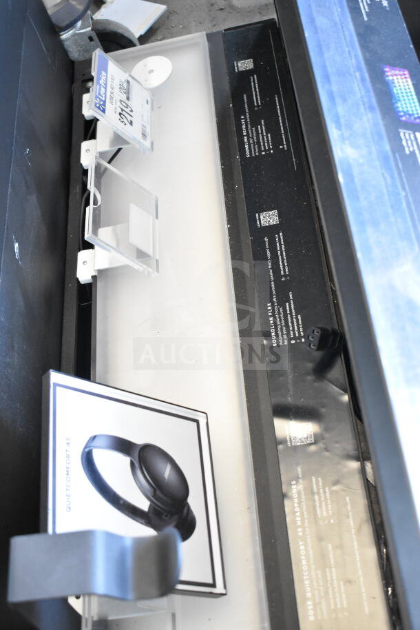 3 store displays featuring Bose QuietComfort 45 headphones and accessories. Excellent for retail use.