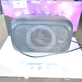 Onn Medium Party Speaker store display showing Bluetooth, 200W power, 20-hour battery, LED lighting, in good condition.