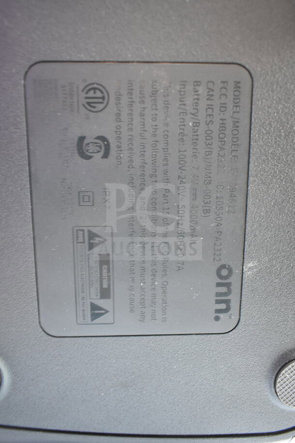Label on Onn Medium Party Speaker showing model SB00049B12, FCC ID HBOPA532, IPX7 rating, and 4000mAh battery.