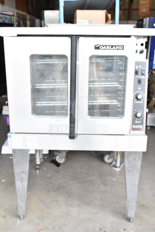 Garland Master 200 convection oven with view-through doors, thermostatic controls, and metal legs. Commercial-grade.