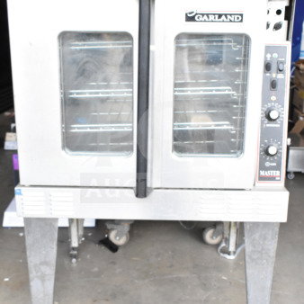 Garland Master 200 convection oven with view-through doors, thermostatic controls, and metal legs. Commercial-grade.