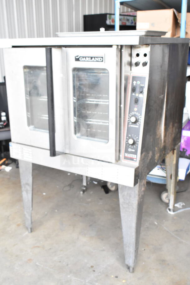 Garland Master 200 convection oven with view-through doors, thermostatic controls, on metal legs. Used condition.