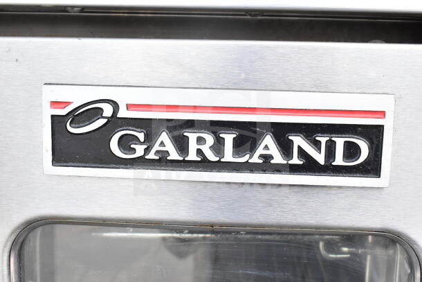 Garland Master 200 convection oven with view-through doors, thermostatic controls, metal legs. Garland logo visible.