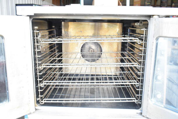 Garland Master 200 convection oven, view-through doors, thermostatic controls, metal legs, good condition.