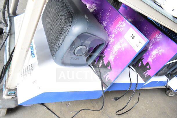 Medium-sized party speakers on store display with original packaging showcasing a vibrant design. Qty: 2 units.