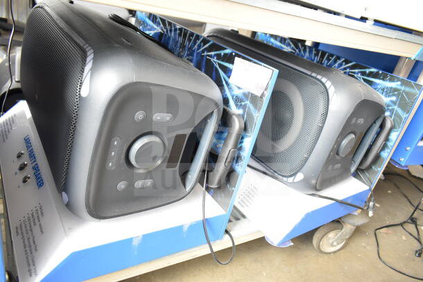 2 store display with large party speakers, featuring control panels and handles. Ideal for high-volume audio.