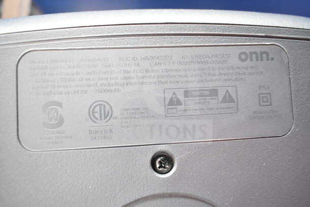 Label on the back of an Onn large party speaker showing model 100094813, 2500mAh battery, IPX4 rating, and safety certifications.