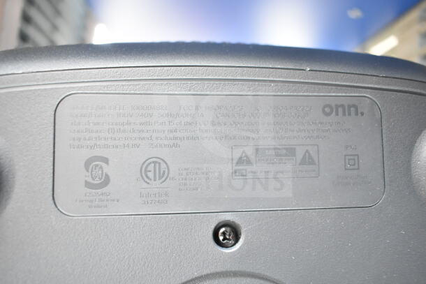 Onn large party speaker label showing model number 1000094813, input details, and certification marks.