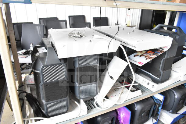 3 store display Ion speakers on shelves with packaging and cables visible. Gray finish, slightly used condition.