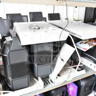 3 store display Ion speakers on shelves with packaging and cables visible. Gray finish, slightly used condition.