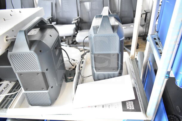 3-store display with Ion speakers, features include wide-range sound. Visible wear, includes cables and paperwork.