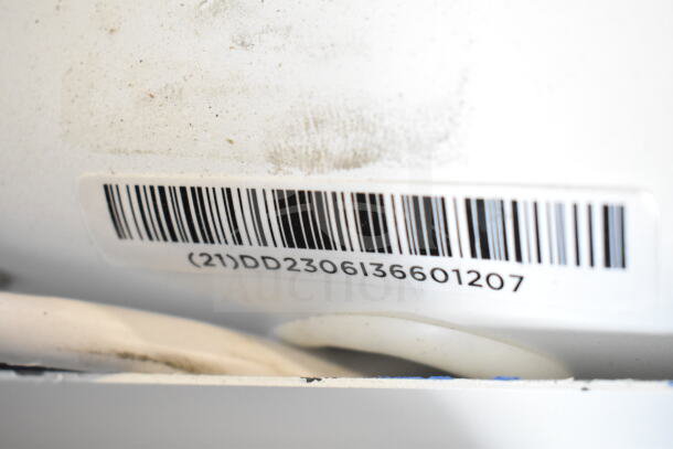 Barcode on a white surface with number (21)DD2306136601207 visible, related to auction item 3 Store Display with Ion Speaker.
