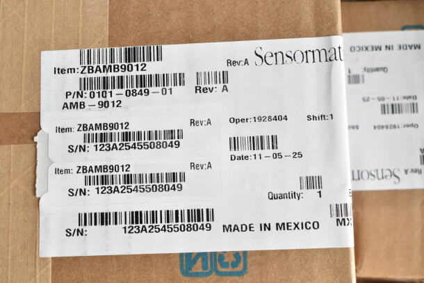 Sensormatic ZBAMB9012 item box with barcode labels, serial number 123A2545508049, Rev:A. Made in Mexico.