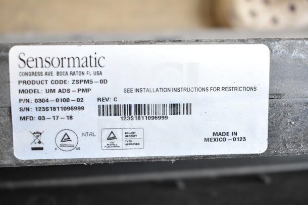 Sensormatic UM ADS PMP anti-theft scanner label; product code ZSPM5-0D; made in Mexico; serial number 123S1811096999.